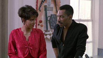 Movie still from “Boomerang” (1992), directed by Reginald Hudlin – A man and a woman talking to each other; Medium shot, Over the shoulder angle