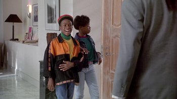 Movie still from “Boomerang” (1992), directed by Reginald Hudlin – Two young people standing in a room next to each other; Medium shot, Over the shoulder angle