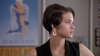 Movie still from “Boomerang” (1992), directed by Reginald Hudlin – A woman with short brown hair wearing a black top; Close Up shot, Over the shoulder angle