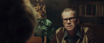 Movie still from “Borg vs. McEnroe” (2017), directed by Janus Metz – A man in glasses sitting in front of a woman; Close Up shot, Over the shoulder angle