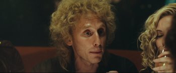 Movie still from “Borg vs. McEnroe” (2017), directed by Janus Metz – A person with curly blonde hair; Close Up shot, Low angle