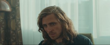 Movie still from “Borg vs. McEnroe” (2017), directed by Janus Metz – A person with long hair; Close Up shot, Over the shoulder angle