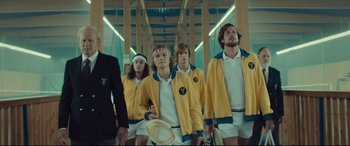 Movie still from “Borg vs. McEnroe” (2017), directed by Janus Metz – A group of people standing next to each other holding tennis rackets; Medium shot, Low angle