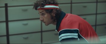 Movie still from “Borg vs. McEnroe” (2017), directed by Janus Metz – A person wearing a headband; Close Up shot, Low angle