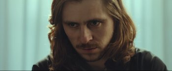 Movie still from “Borg vs. McEnroe” (2017), directed by Janus Metz – A person with long hair; Close Up shot, Over the shoulder angle
