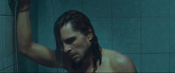 Movie still from “Borg vs. McEnroe” (2017), directed by Janus Metz – A man with long hair is taking a shower; Close Up shot, Low angle