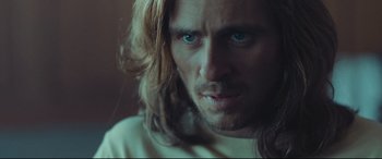 Movie still from “Borg vs. McEnroe” (2017), directed by Janus Metz – A person with long hair; Close Up shot, Over the shoulder angle