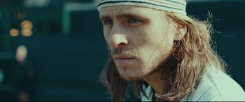Movie still from “Borg vs. McEnroe” (2017), directed by Janus Metz – A person with long dreadlocks; Close Up shot, Low angle