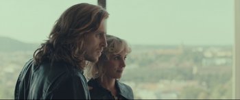 Movie still from “Borg vs. McEnroe” (2017), directed by Janus Metz – A man and a woman standing next to each other in front of a window; Close Up shot, Over the shoulder angle