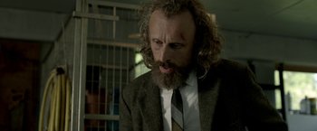 A man with a long beard and a suit and tie