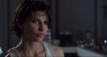 Movie still from “Bound” (1996), directed by Lilly Wachowski – A person with short brown hair; Close Up shot, Low angle