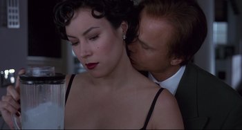 Movie still from “Bound” (1996), directed by Lilly Wachowski – A man and a woman are kissing in a room; Close Up shot, Low angle
