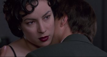 Movie still from “Bound” (1996), directed by Lilly Wachowski – A man and a woman looking into each other's eyes; Close Up shot, Over the shoulder angle