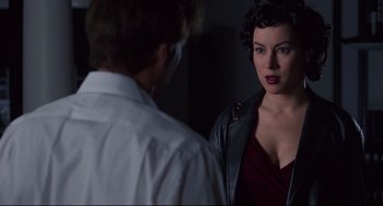 Movie still from “Bound” (1996), directed by Lilly Wachowski – A man and a woman are looking at each other; Close Up shot, Over the shoulder angle