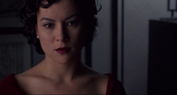 Movie still from “Bound” (1996), directed by Lilly Wachowski – A person wearing a red dress; Close Up shot, Low angle