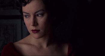 Movie still from “Bound” (1996), directed by Lilly Wachowski – A person wearing a red dress; Close Up shot, High angle