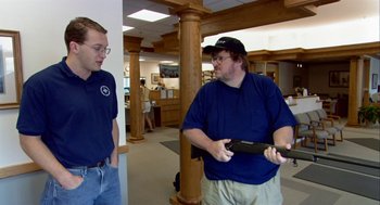 Movie still from “Bowling for Columbine” (2002), directed by Michael Moore – Two men are playing a video game in a room; Medium shot, Over the shoulder angle