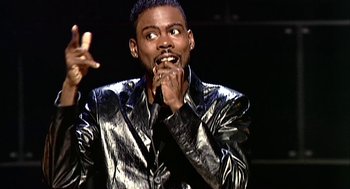 Movie still from “Bowling for Columbine” (2002), directed by Michael Moore – A man in a leather jacket holding his mouth open; Close Up shot, High angle