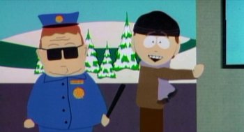 Movie still from “Bowling for Columbine” (2002), directed by Michael Moore – A man pointing at another man wearing a black hat; Medium shot, Low angle