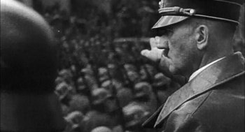 Movie still from “Bowling for Columbine” (2002), directed by Michael Moore – An old photo of a man in a military uniform; Close Up shot, High angle