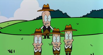Movie still from “Bowling for Columbine” (2002), directed by Michael Moore – A group of cartoon characters in a grassy field; Medium shot, Low angle