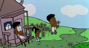 Movie still from “Bowling for Columbine” (2002), directed by Michael Moore – A cartoon of a boy and a girl in a field with flowers; Extreme Wide shot, Low angle