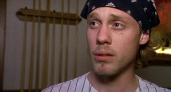 Movie still from “Bowling for Columbine” (2002), directed by Michael Moore – A person wearing a hat; Close Up shot, High angle