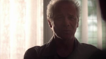 Movie still from “Boy A” (2007), directed by John Crowley – An older man with white hair is looking at the camera; Close Up shot, Low angle