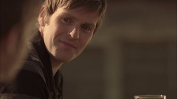 Movie still from “Boy A” (2007), directed by John Crowley – A person smiling for the camera; Close Up shot, Over the shoulder angle