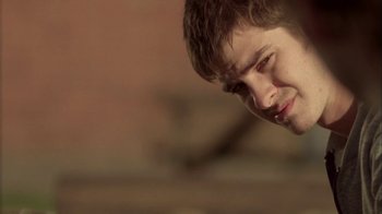Movie still from “Boy A” (2007), directed by John Crowley – A person with his eyes wide open; Close Up shot, Low angle
