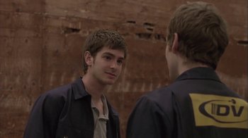 Movie still from “Boy A” (2007), directed by John Crowley – Two young men are looking at one another in the mirror; Close Up shot, Over the shoulder angle