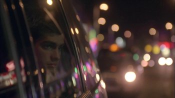 Movie still from “Boy A” (2007), directed by John Crowley – A man looking out of the window of a car at night; Close Up shot, Low angle
