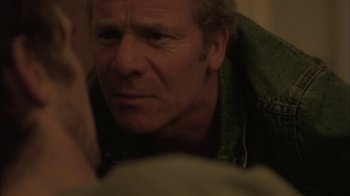 Movie still from “Boy A” (2007), directed by John Crowley – A man looking at the camera; Close Up shot, Over the shoulder angle