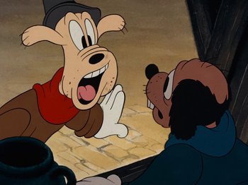 Movie still from “Brave Little Tailor” (1938), directed by Burt Gillett – A goofy dog is looking at another goofy dog; Close Up shot, Over the shoulder angle