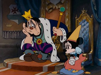 Movie still from “Brave Little Tailor” (1938), directed by Burt Gillett – A cartoon of goofy and mickey mouse sitting on the floor; Wide shot, Low angle
