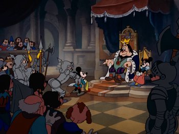 Movie still from “Brave Little Tailor” (1938), directed by Burt Gillett – A group of people sitting in a room; Wide shot, High angle