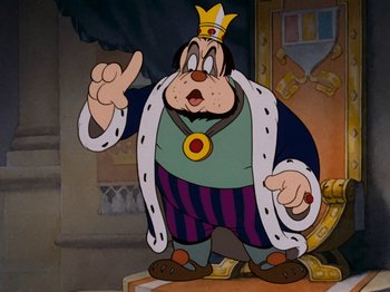 Movie still from “Brave Little Tailor” (1938), directed by Burt Gillett – A cartoon of a man with a crown on his head; Medium shot, Low angle
