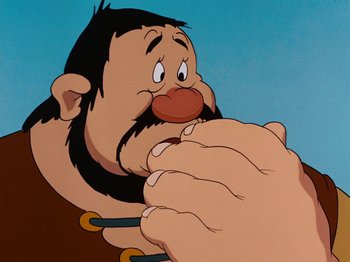 Movie still from “Brave Little Tailor” (1938), directed by Burt Gillett – An animated picture of a man with a beard; Close Up shot, Over the shoulder angle