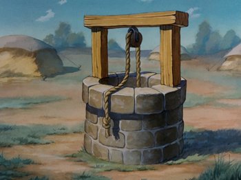 Movie still from “Brave Little Tailor” (1938), directed by Burt Gillett – An image of an old well with a rope on it; Wide shot, High angle