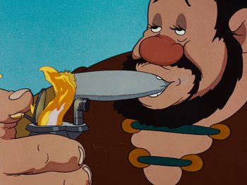 Movie still from “Brave Little Tailor” (1938), directed by Burt Gillett – An animated picture of a man holding a knife in his mouth; Extreme Close Up shot, Low angle