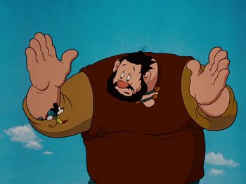 Movie still from “Brave Little Tailor” (1938), directed by Burt Gillett – An animated picture of a man with a beard and mustache; Medium shot, Low angle