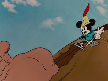Movie still from “Brave Little Tailor” (1938), directed by Burt Gillett – A cartoon of mickey mouse riding a motorcycle down a hill; Extreme Wide shot, Low angle
