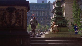 Movie still from “Breakfast at Tiffany's” (1961), directed by Blake Edwards – A man walking up steps in front of a building; Wide shot, High angle