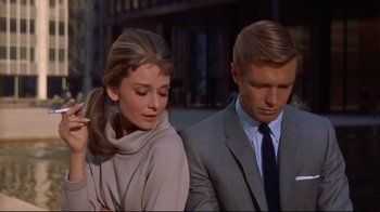 Movie still from “Breakfast at Tiffany's” (1961), directed by Blake Edwards – A man and a woman standing next to each other; Close Up shot, Low angle