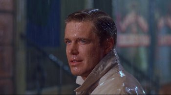 Movie still from “Breakfast at Tiffany's” (1961), directed by Blake Edwards – A person wearing a white jacket; Close Up shot, Over the shoulder angle