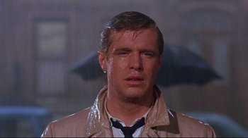 Movie still from “Breakfast at Tiffany's” (1961), directed by Blake Edwards – A person wearing a suit and tie; Close Up shot, Low angle