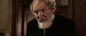 An old man with a beard and a white beard