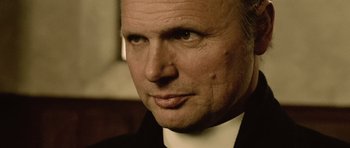 A person wearing a suit and tie