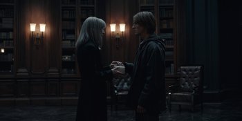 Movie still from “Dark” (2017), created by Baran bo Odar – Two people standing next to each other in a room; Medium shot, Over the shoulder angle