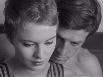 Movie still from “Breathless” (1960), directed by Jean-Luc Godard – A man and a woman looking at each other; Close Up shot, High angle